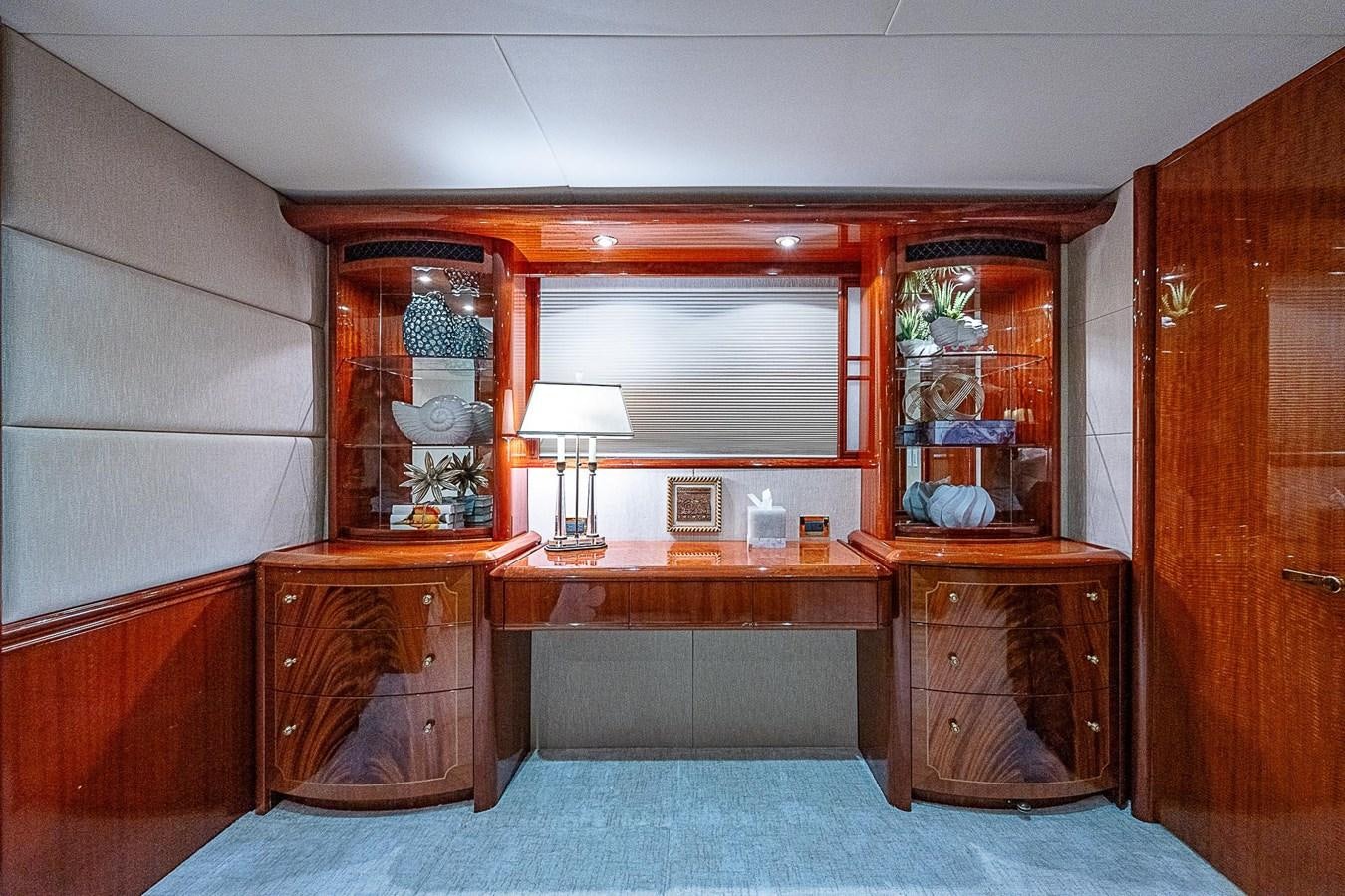 a room with a desk and a mirror aboard LAZZARA 116 OPEN BRIDGE Yacht for Sale