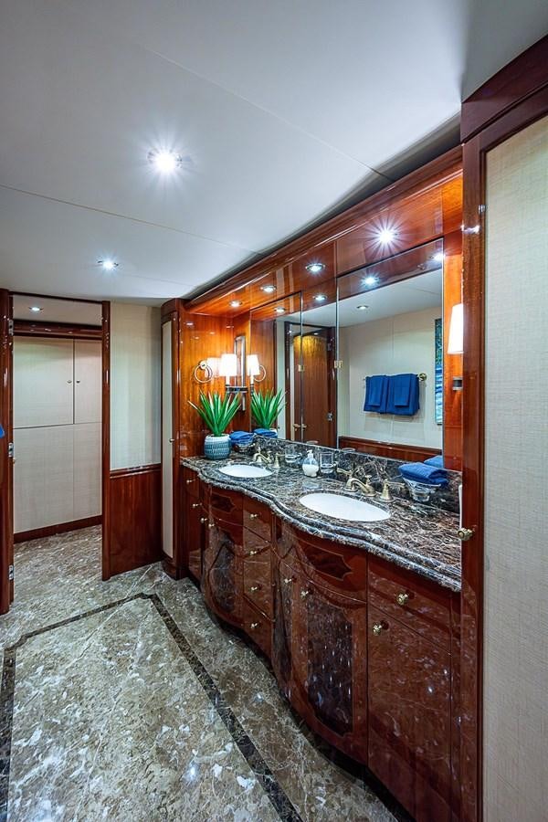 a bathroom with a large mirror aboard LAZZARA 116 OPEN BRIDGE Yacht for Sale
