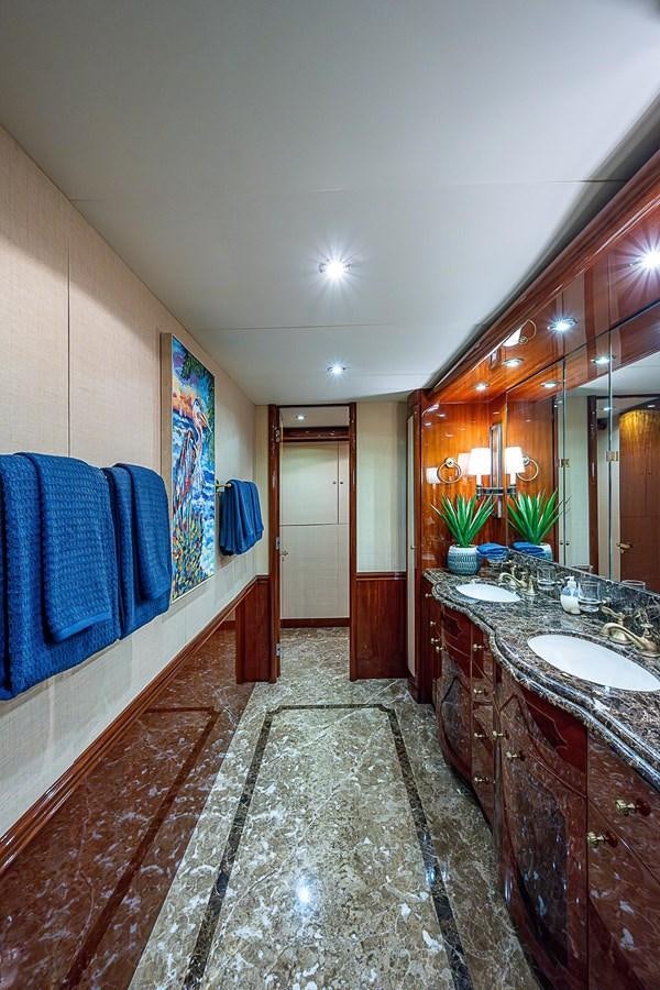 a bathroom with a marble floor aboard LAZZARA 116 OPEN BRIDGE Yacht for Sale