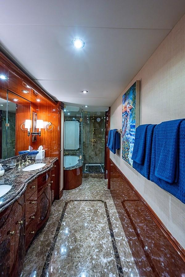 a bathroom with a marble floor aboard LAZZARA 116 OPEN BRIDGE Yacht for Sale