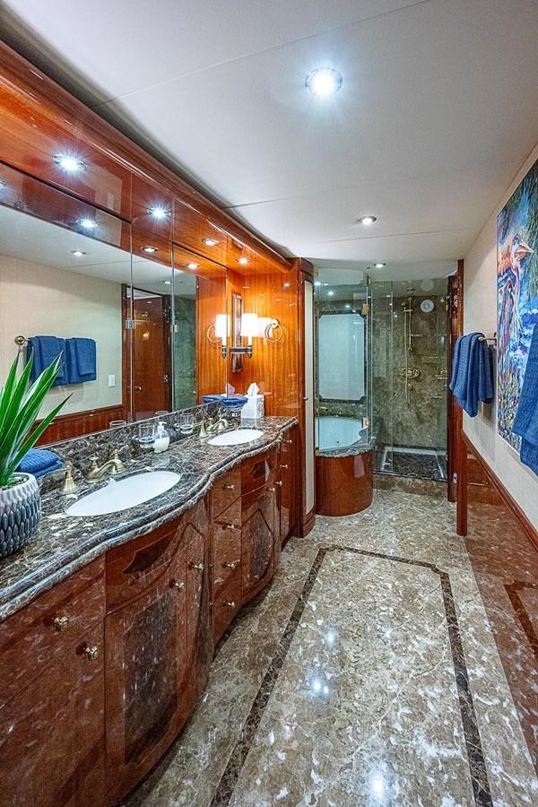 a bathroom with a marble counter top aboard LAZZARA 116 OPEN BRIDGE Yacht for Sale