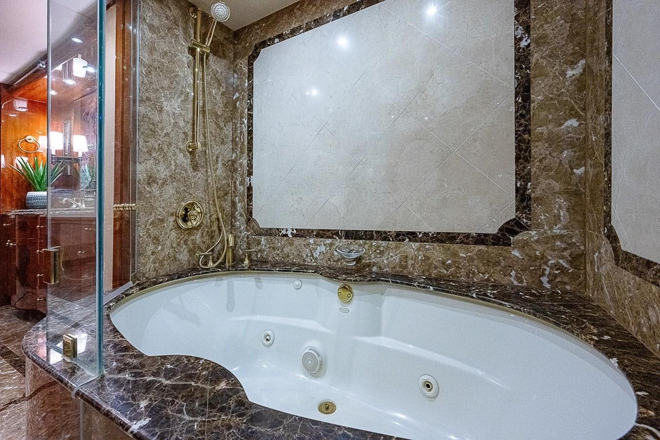 a bathroom with a large bathtub aboard LAZZARA 116 OPEN BRIDGE Yacht for Sale