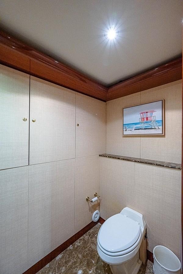 a bathroom with a toilet and a sink aboard LAZZARA 116 OPEN BRIDGE Yacht for Sale