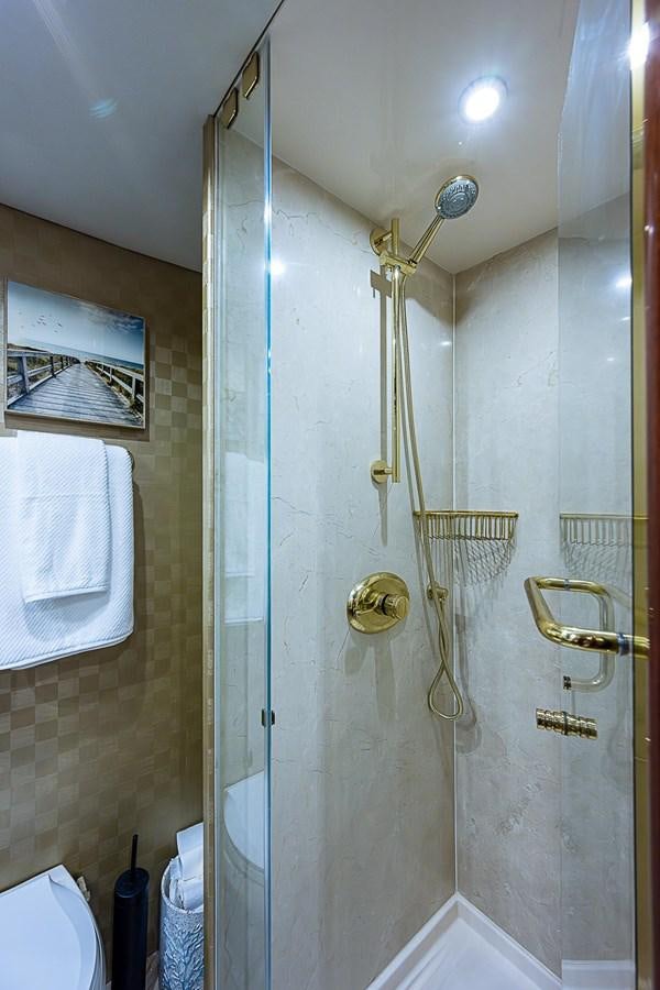 a shower with a glass door aboard LAZZARA 116 OPEN BRIDGE Yacht for Sale