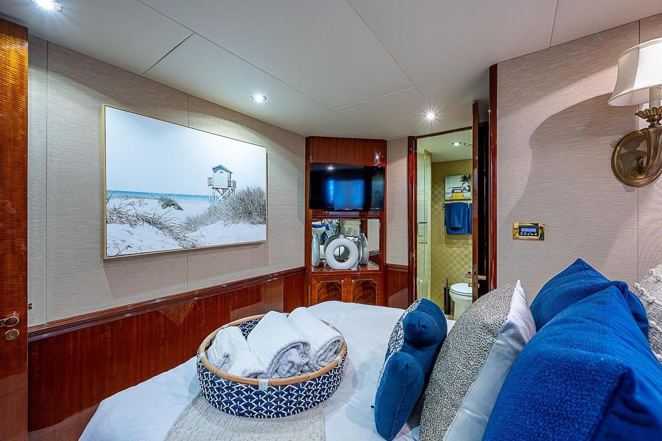 a bedroom with a basket aboard LAZZARA 116 OPEN BRIDGE Yacht for Sale