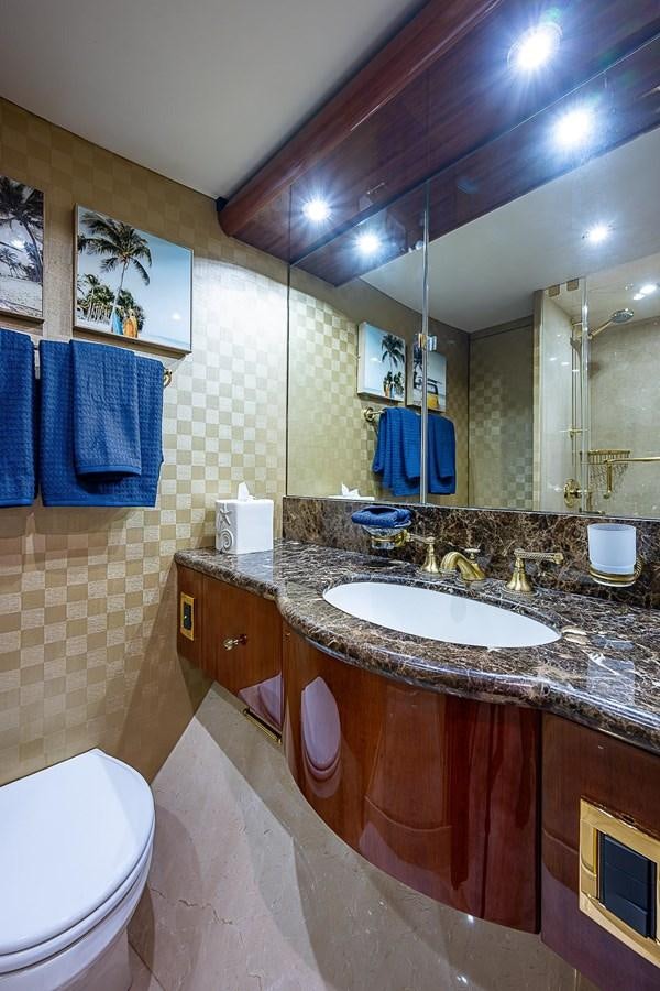 a bathroom with a large mirror aboard LAZZARA 116 OPEN BRIDGE Yacht for Sale