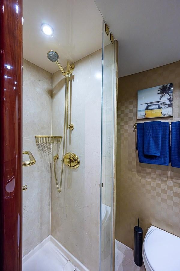 a shower with a glass door aboard LAZZARA 116 OPEN BRIDGE Yacht for Sale