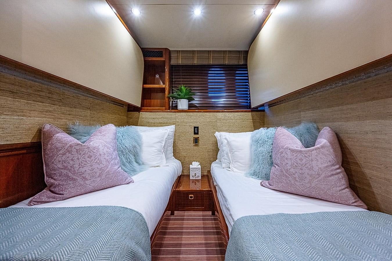 a room with two beds aboard LAZZARA 116 OPEN BRIDGE Yacht for Sale