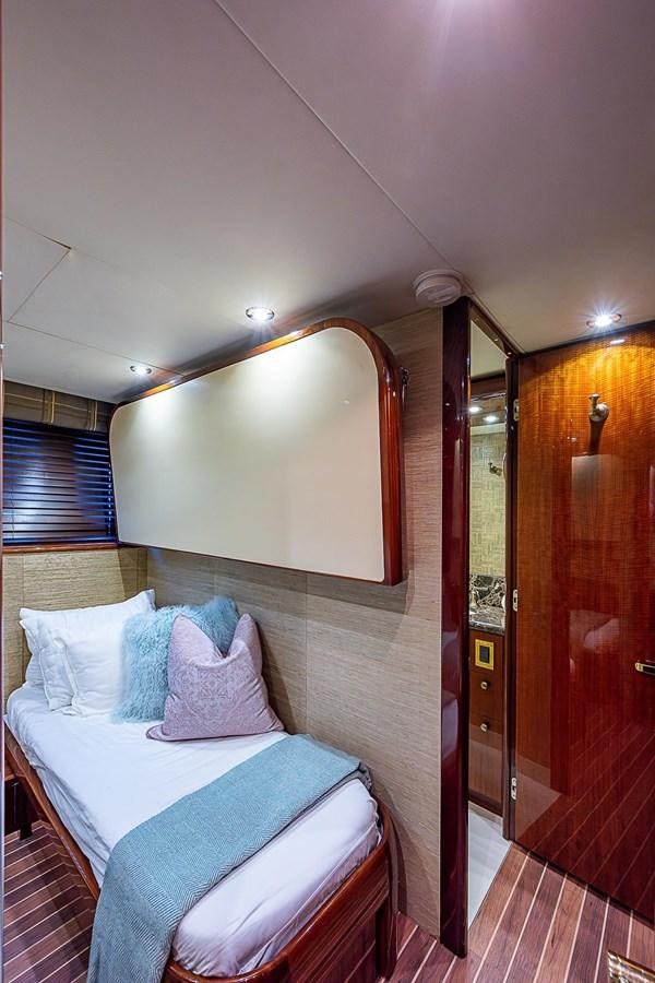 a bed in a room aboard LAZZARA 116 OPEN BRIDGE Yacht for Sale