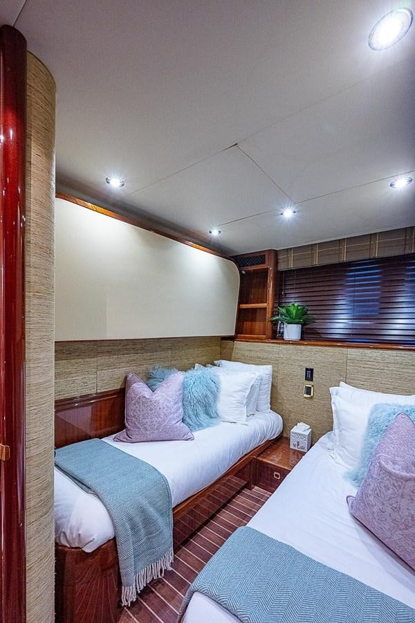 a room with two beds aboard LAZZARA 116 OPEN BRIDGE Yacht for Sale