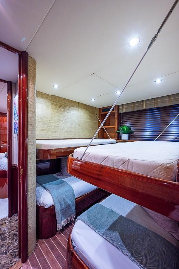 a couple of beds in a room aboard LAZZARA 116 OPEN BRIDGE Yacht for Sale