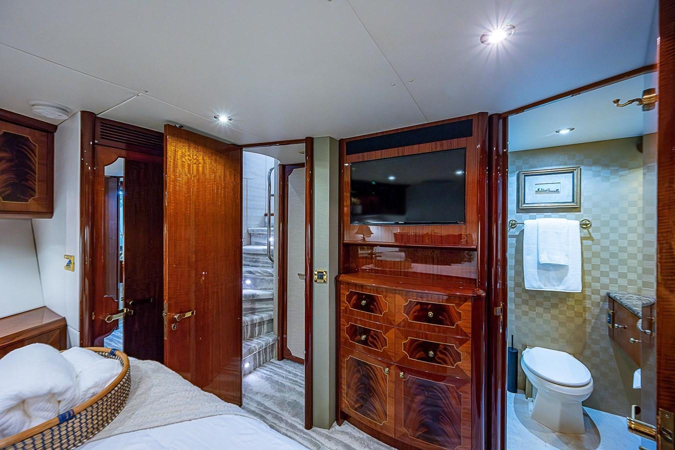 a bathroom with a sink and a mirror aboard LAZZARA 116 OPEN BRIDGE Yacht for Sale