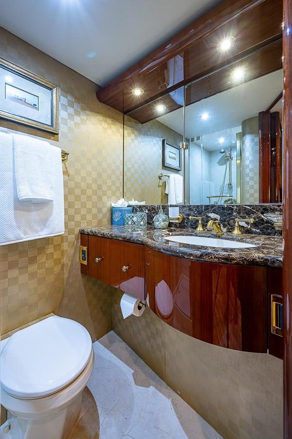 a bathroom with a sink and a toilet aboard LAZZARA 116 OPEN BRIDGE Yacht for Sale