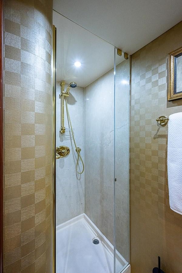 a shower with a glass door aboard LAZZARA 116 OPEN BRIDGE Yacht for Sale
