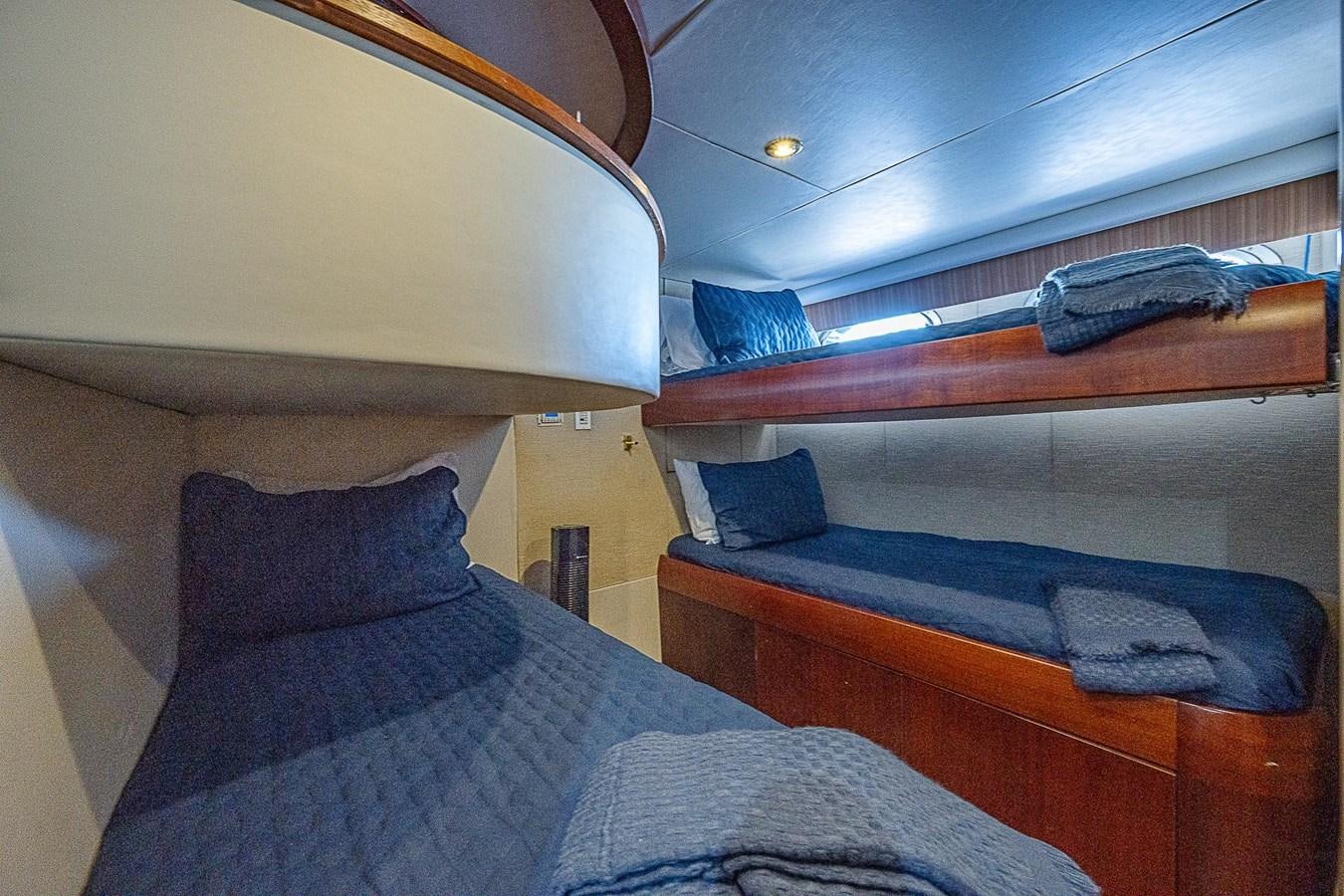 a couple of beds in a room aboard LAZZARA 116 OPEN BRIDGE Yacht for Sale