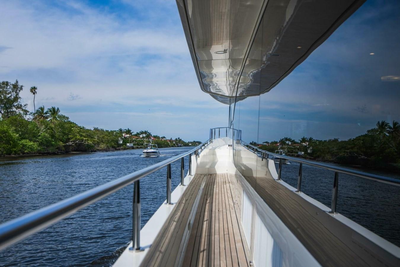 a long dock leading to a boat with Sundial Bridge at Turtle Bay in the background aboard NEW ARRIVAL Yacht for Sale