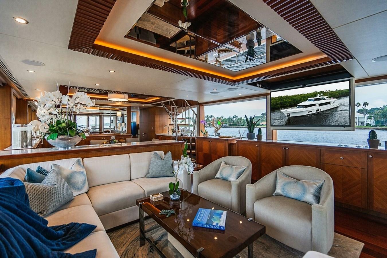 a living room with a large window aboard NEW ARRIVAL Yacht for Sale