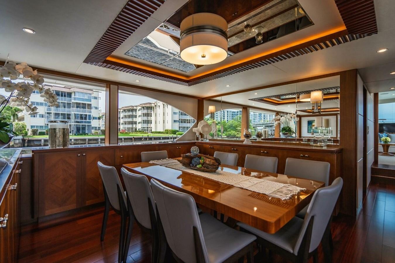 a dining room with a table and chairs aboard NEW ARRIVAL Yacht for Sale