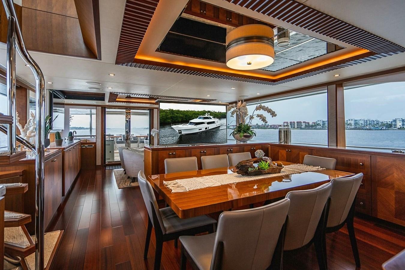 a large dining room with a large table and chairs aboard NEW ARRIVAL Yacht for Sale