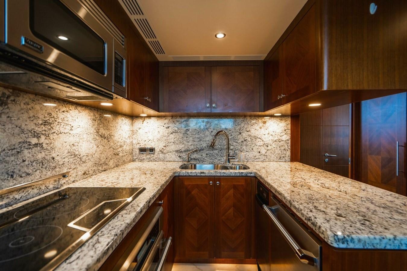 a kitchen with marble counters aboard NEW ARRIVAL Yacht for Sale
