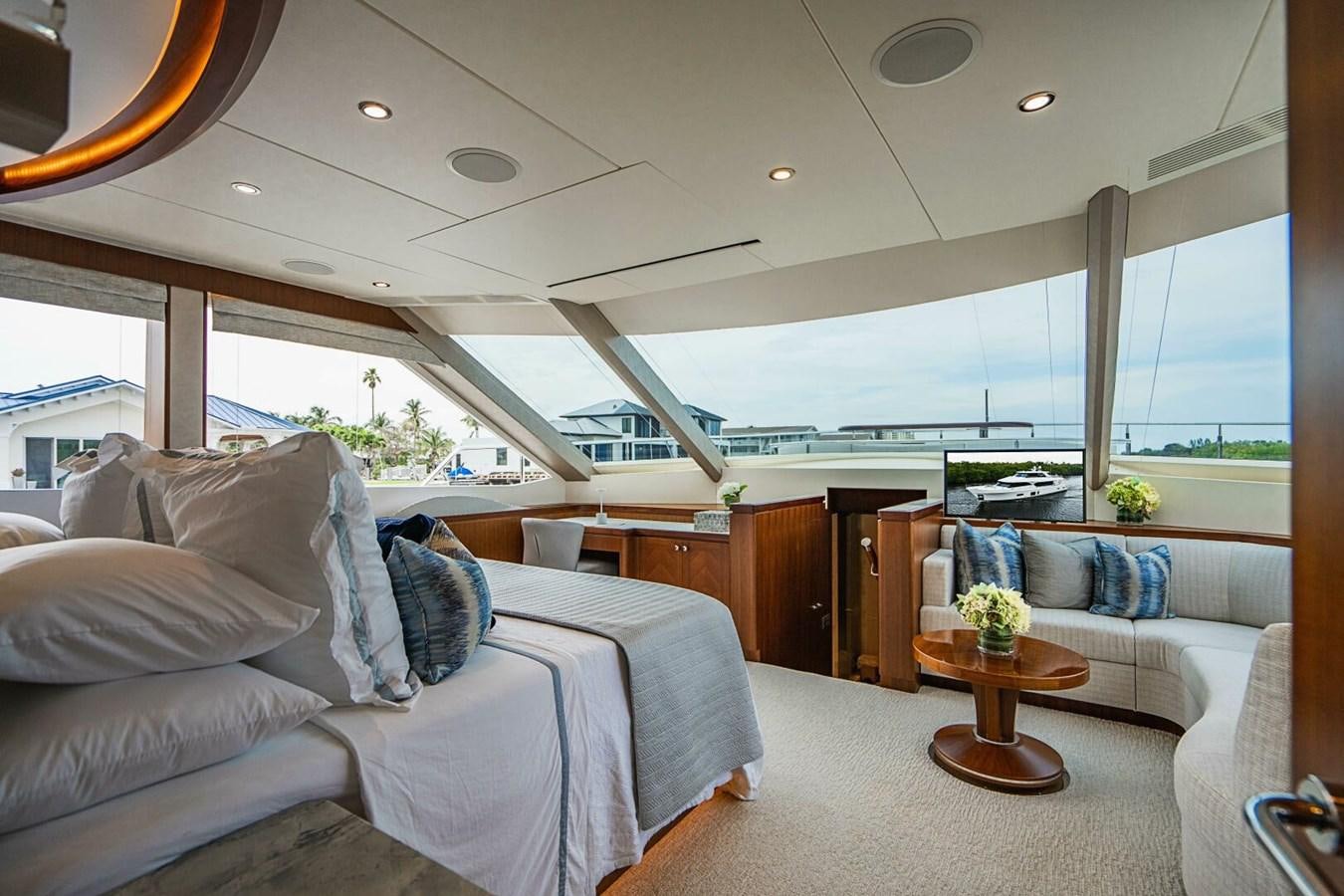 a modern bedroom with a large window aboard NEW ARRIVAL Yacht for Sale