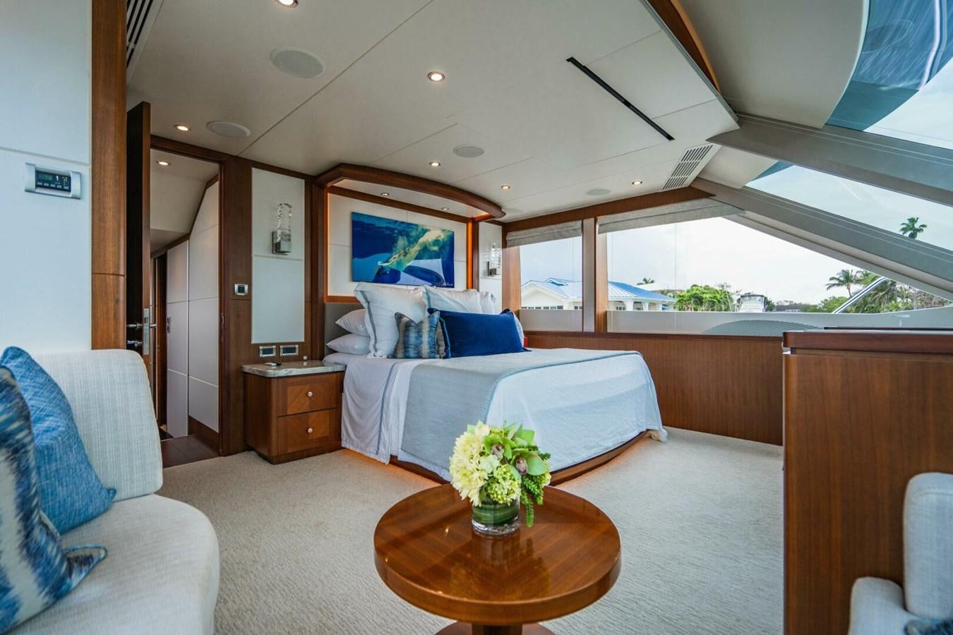 a room with a bed and a table aboard NEW ARRIVAL Yacht for Sale