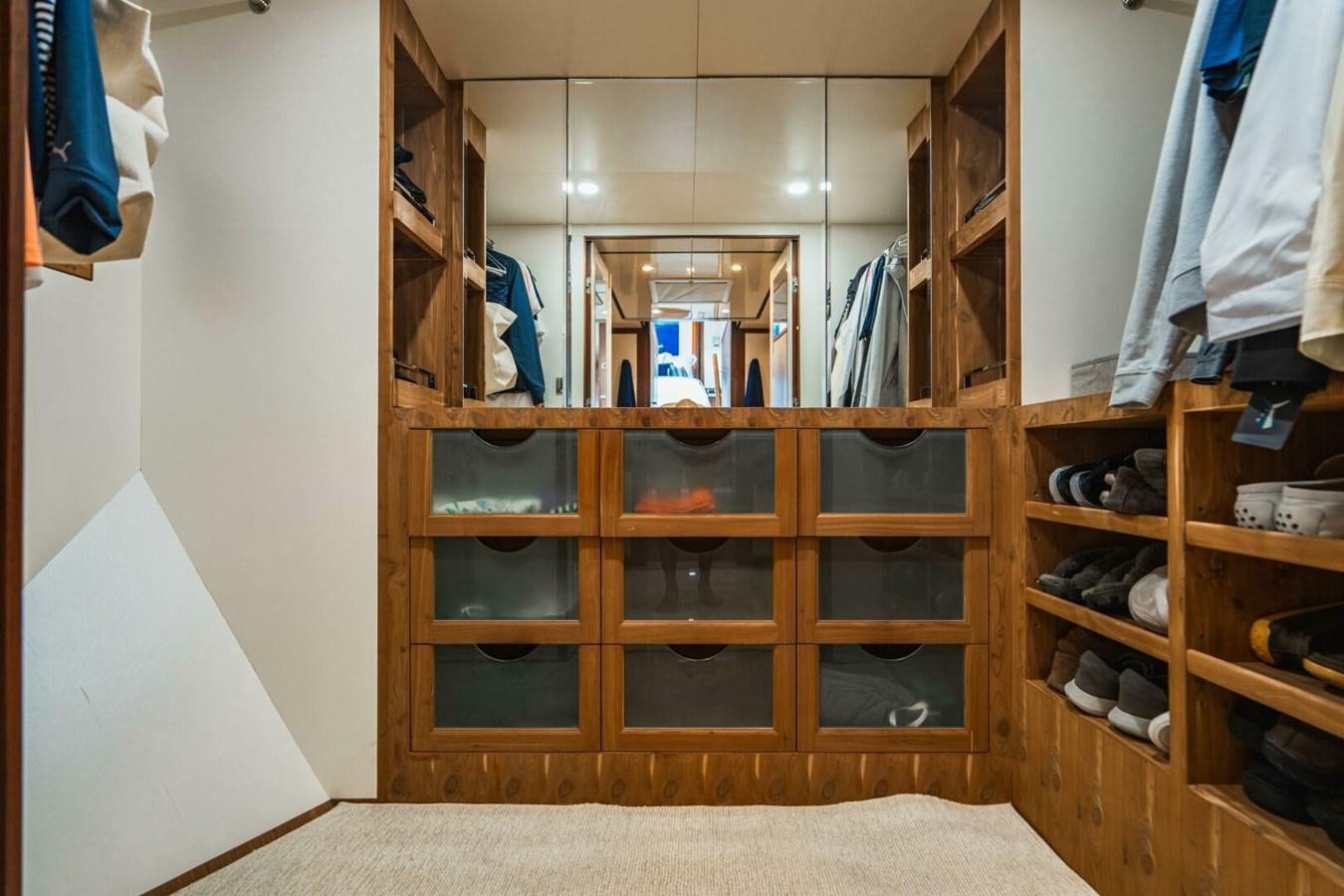 a wooden cabinet with drawers aboard NEW ARRIVAL Yacht for Sale