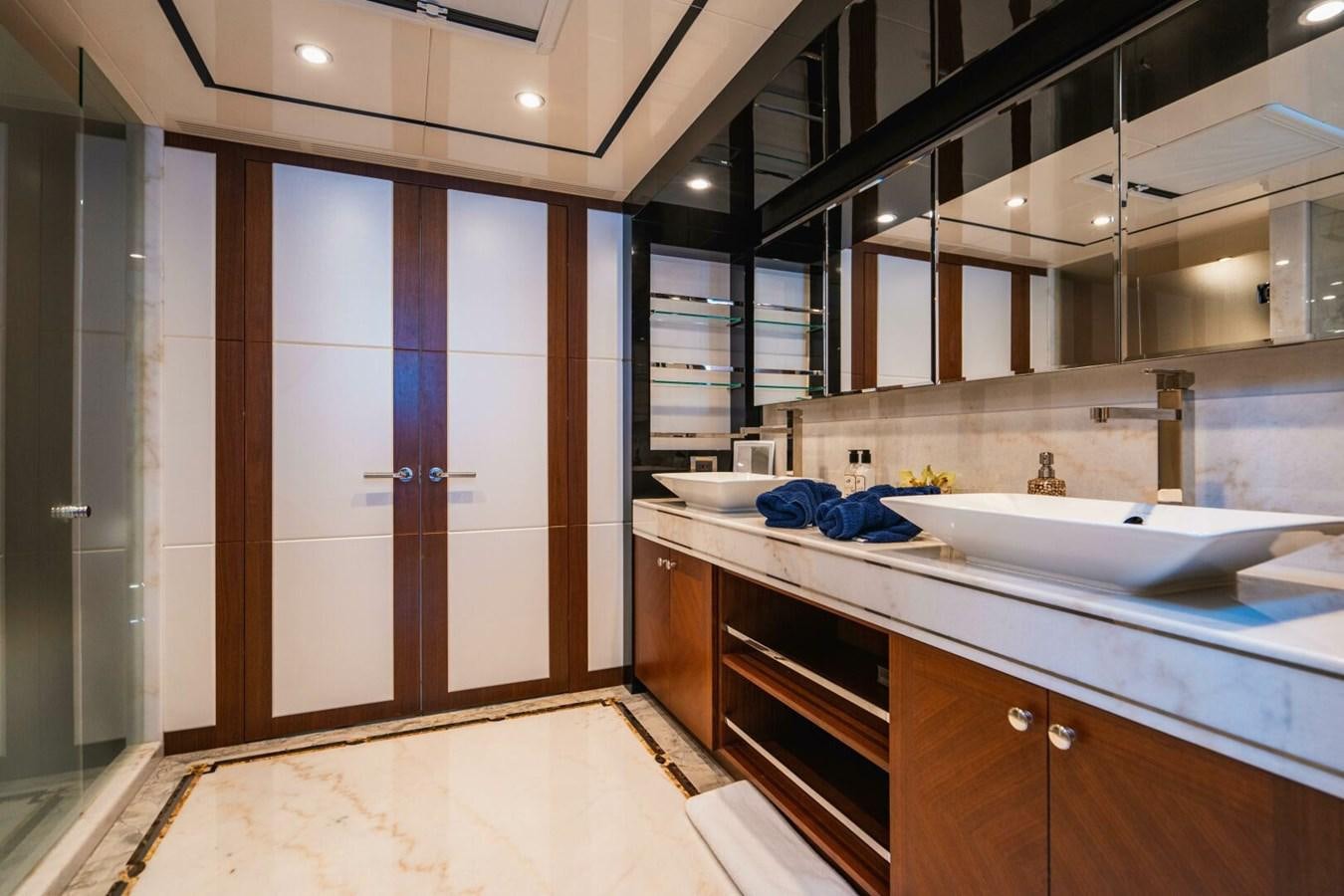 a bathroom with a sink and a mirror aboard NEW ARRIVAL Yacht for Sale