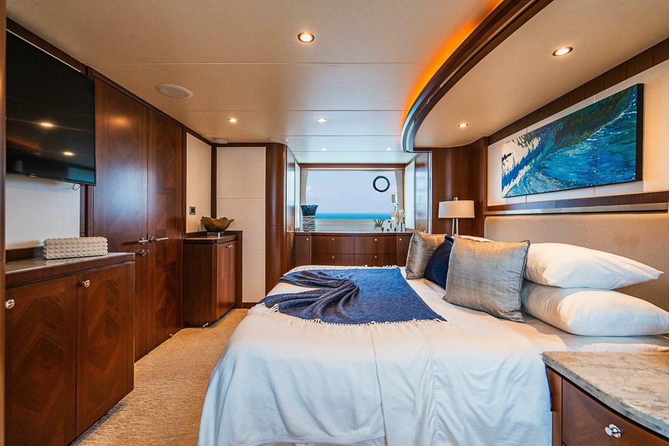 a bedroom with a large bed aboard NEW ARRIVAL Yacht for Sale