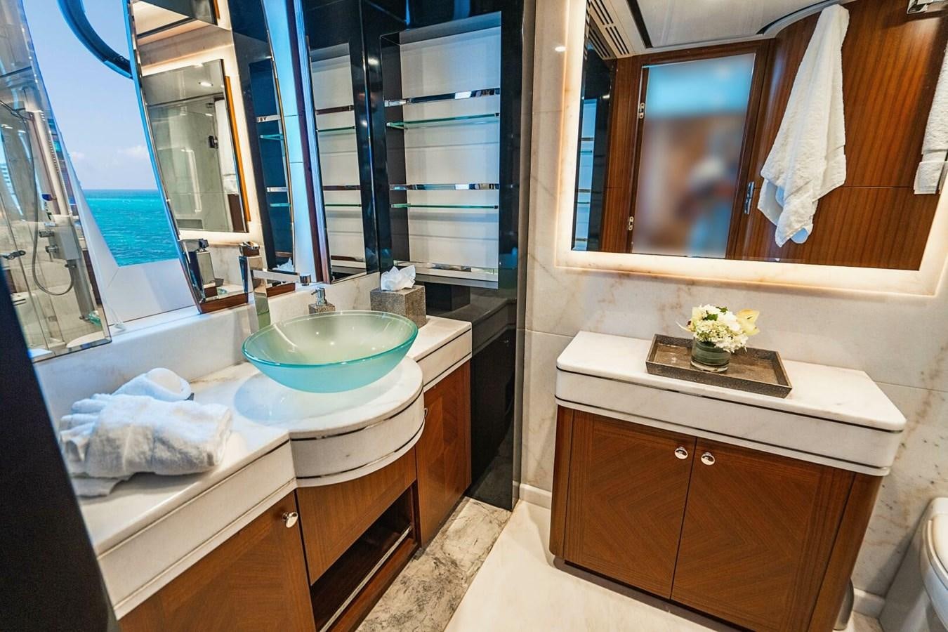a bathroom with a sink and a mirror aboard NEW ARRIVAL Yacht for Sale
