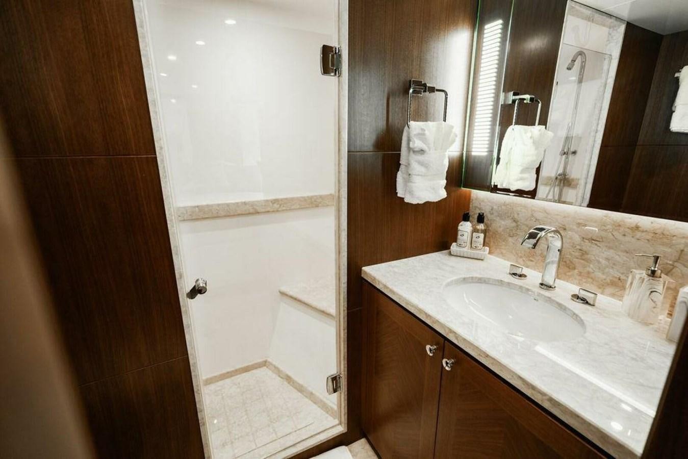 a bathroom with a sink and a mirror aboard NEW ARRIVAL Yacht for Sale