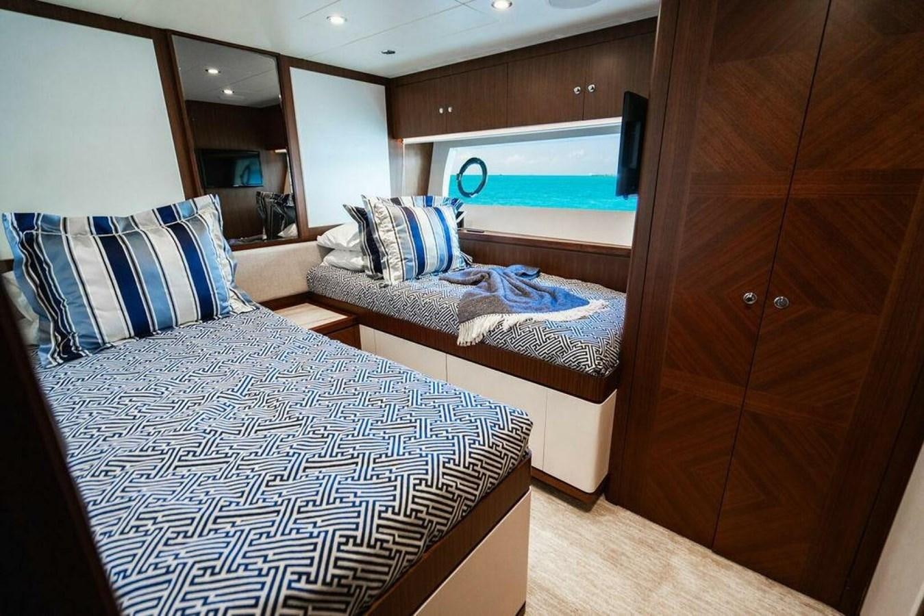 a room with two beds aboard NEW ARRIVAL Yacht for Sale