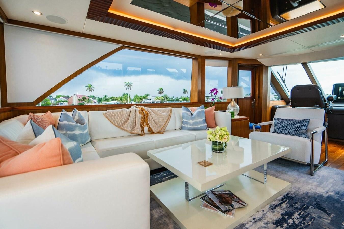 a living room with a large window aboard NEW ARRIVAL Yacht for Sale