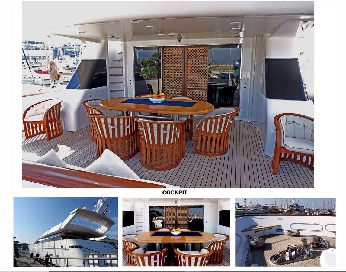 a room with tables and chairs aboard SPYK Yacht for Sale