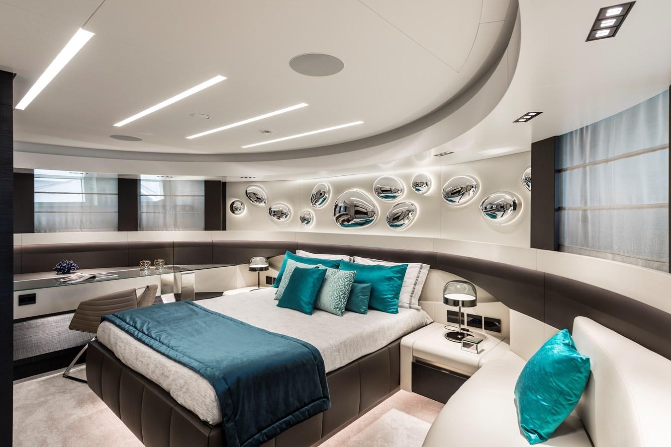 a room with a bed and a window aboard CHORUSLINE Yacht for Sale