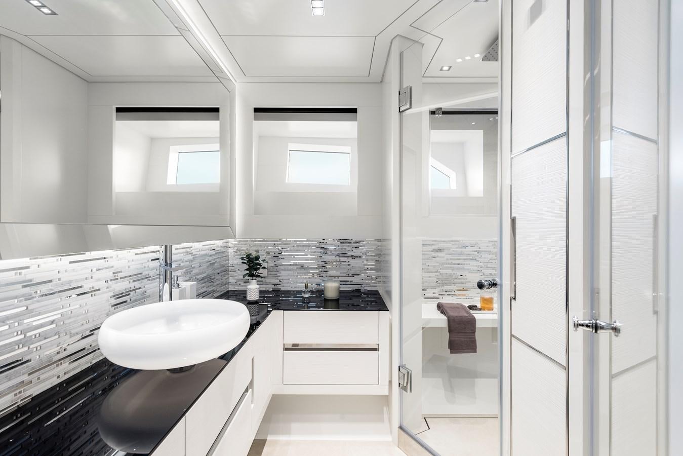 a bathroom with a sink and a shower aboard CHORUSLINE Yacht for Sale