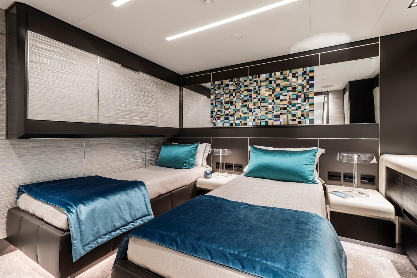 a room with two beds aboard CHORUSLINE Yacht for Sale