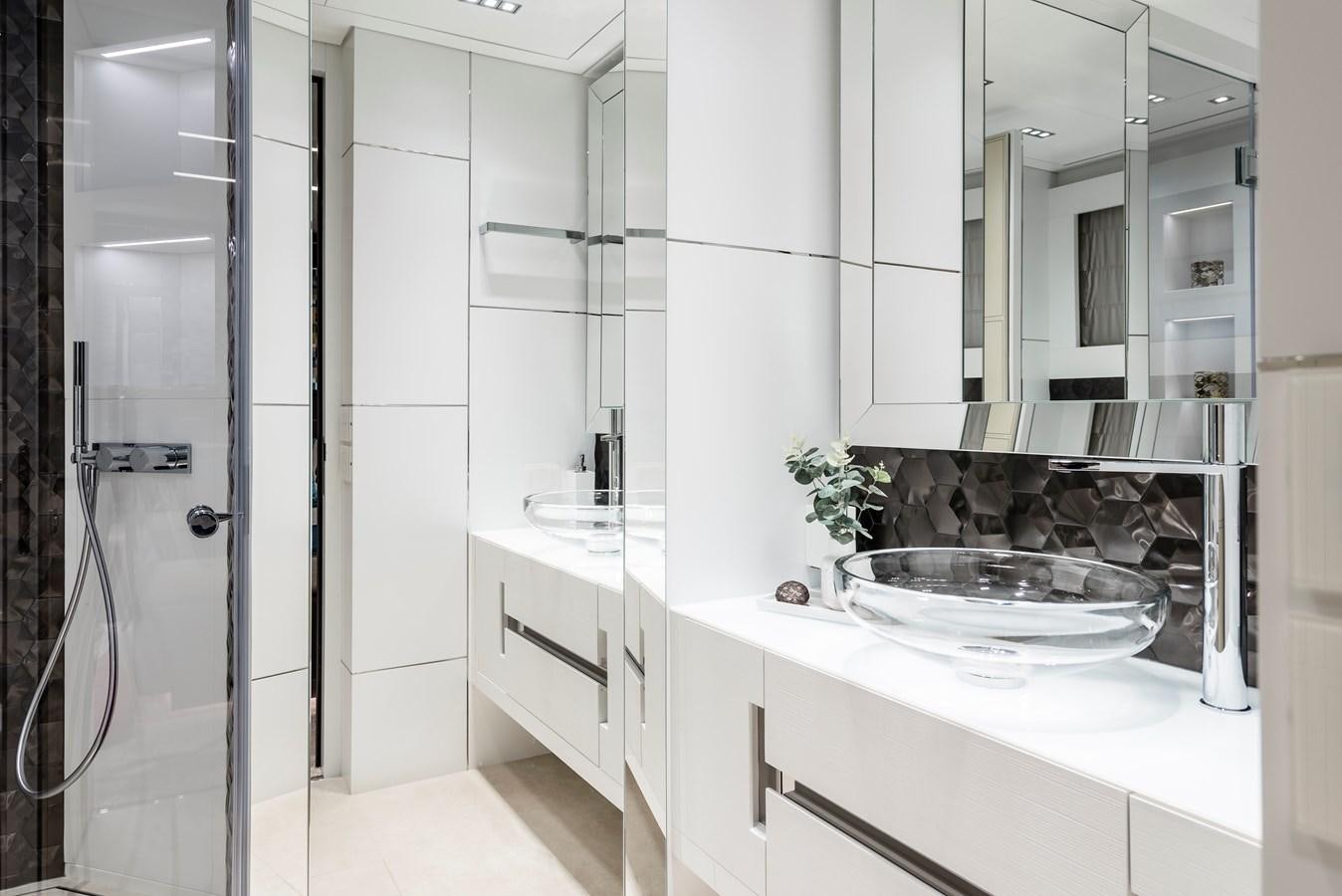 a bathroom with a sink and a mirror aboard CHORUSLINE Yacht for Sale