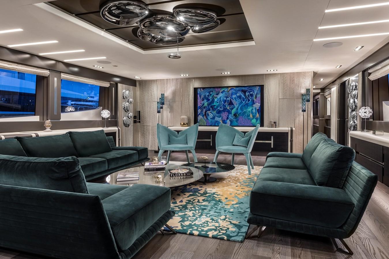 a living room with couches and a table aboard CHORUSLINE Yacht for Sale