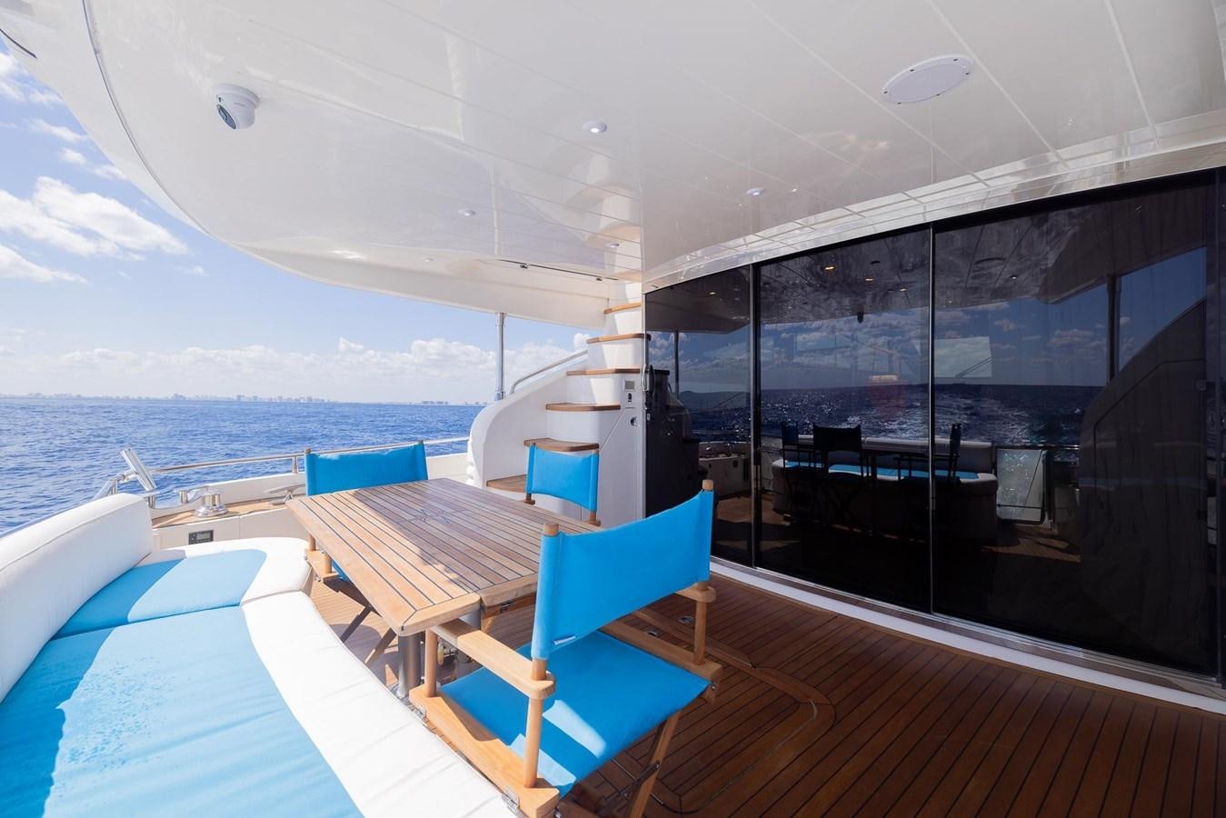 a room with a view of the ocean and the deck aboard COOL BREEZE Yacht for Sale