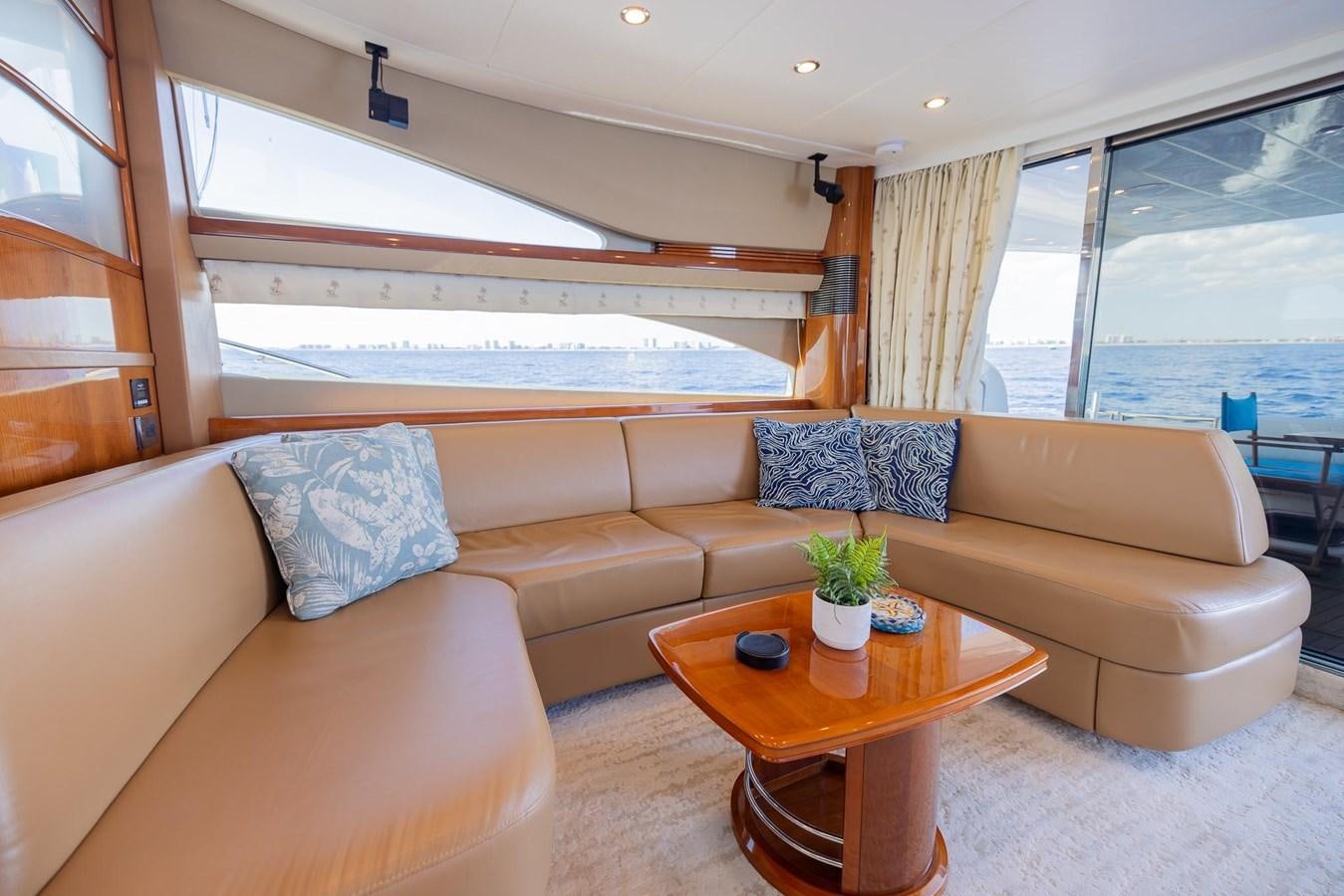 a living room with a couch and a coffee table aboard COOL BREEZE Yacht for Sale