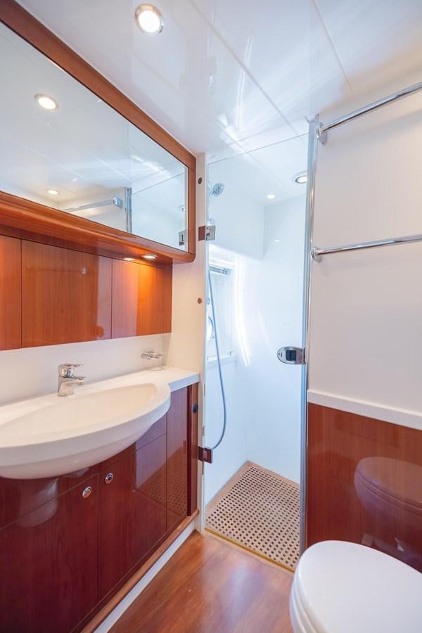 a bathroom with a sink and a toilet aboard COOL BREEZE Yacht for Sale