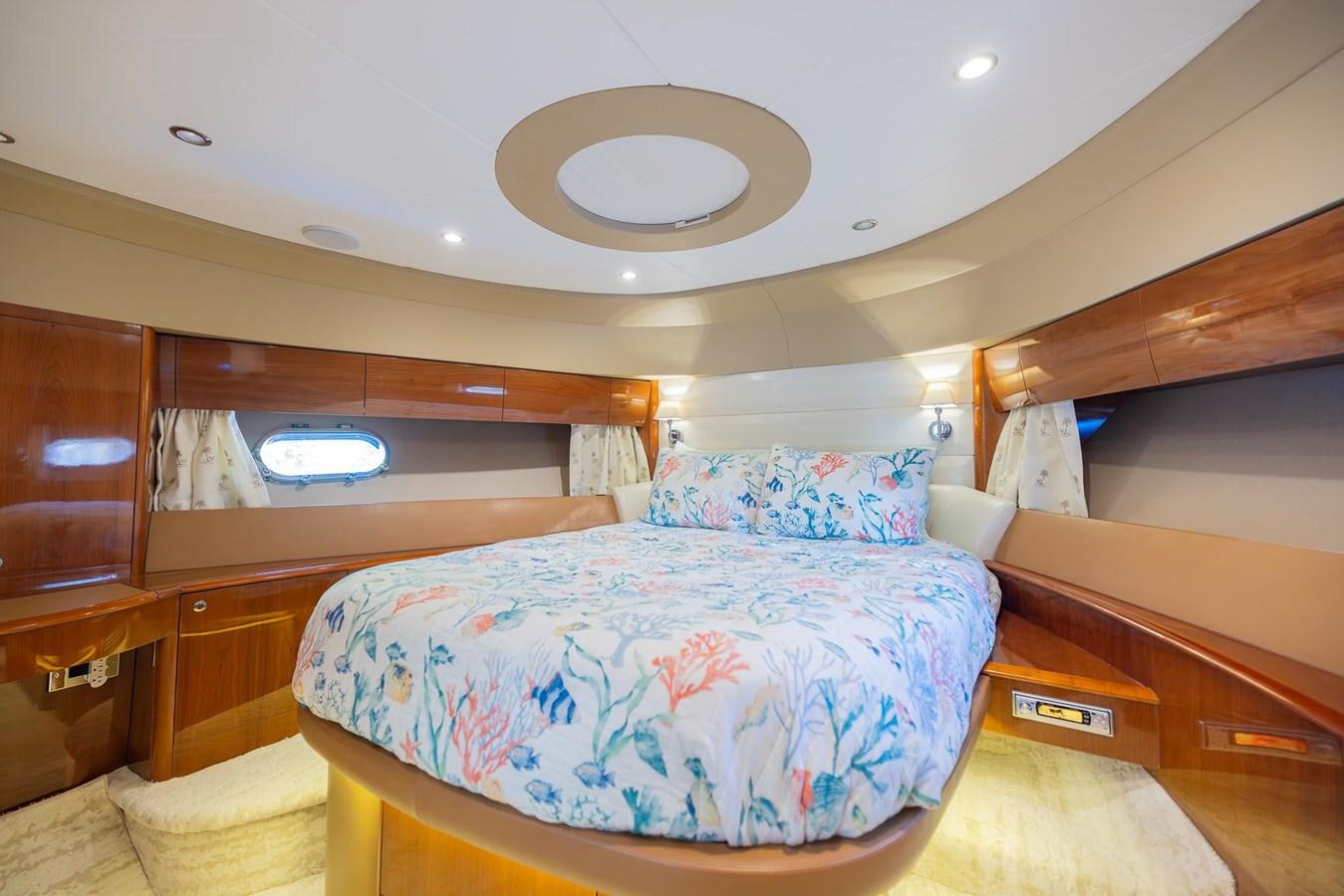a room with a bed and a fan aboard COOL BREEZE Yacht for Sale