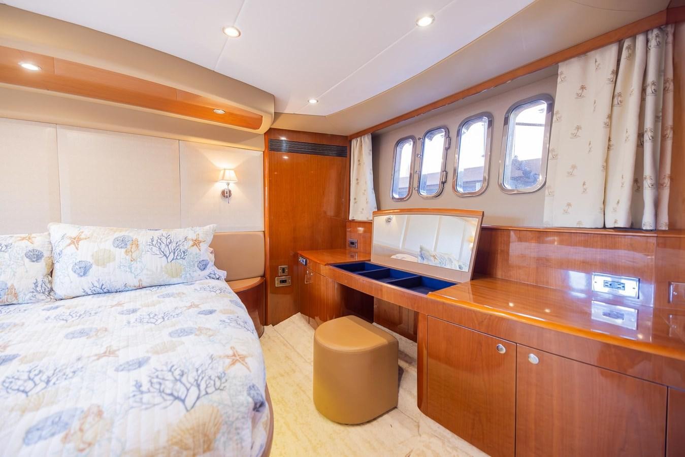 a room with a bed and a desk aboard COOL BREEZE Yacht for Sale