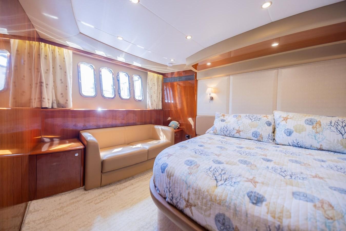 a room with a bed and a couch aboard COOL BREEZE Yacht for Sale