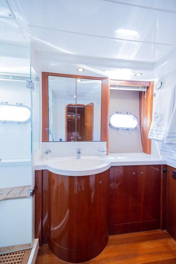 a bathroom with a sink and a mirror aboard COOL BREEZE Yacht for Sale