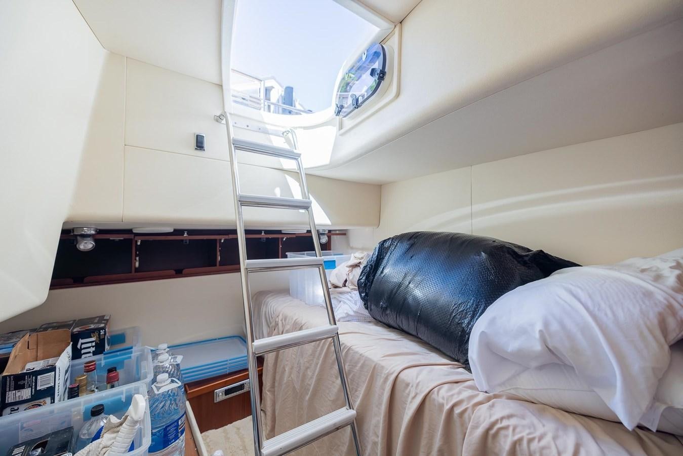 a person lying on a bed aboard COOL BREEZE Yacht for Sale