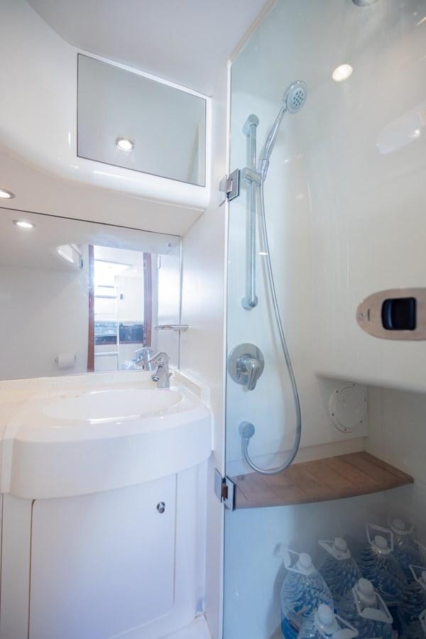 a shower unit and sink in a bathroom aboard COOL BREEZE Yacht for Sale