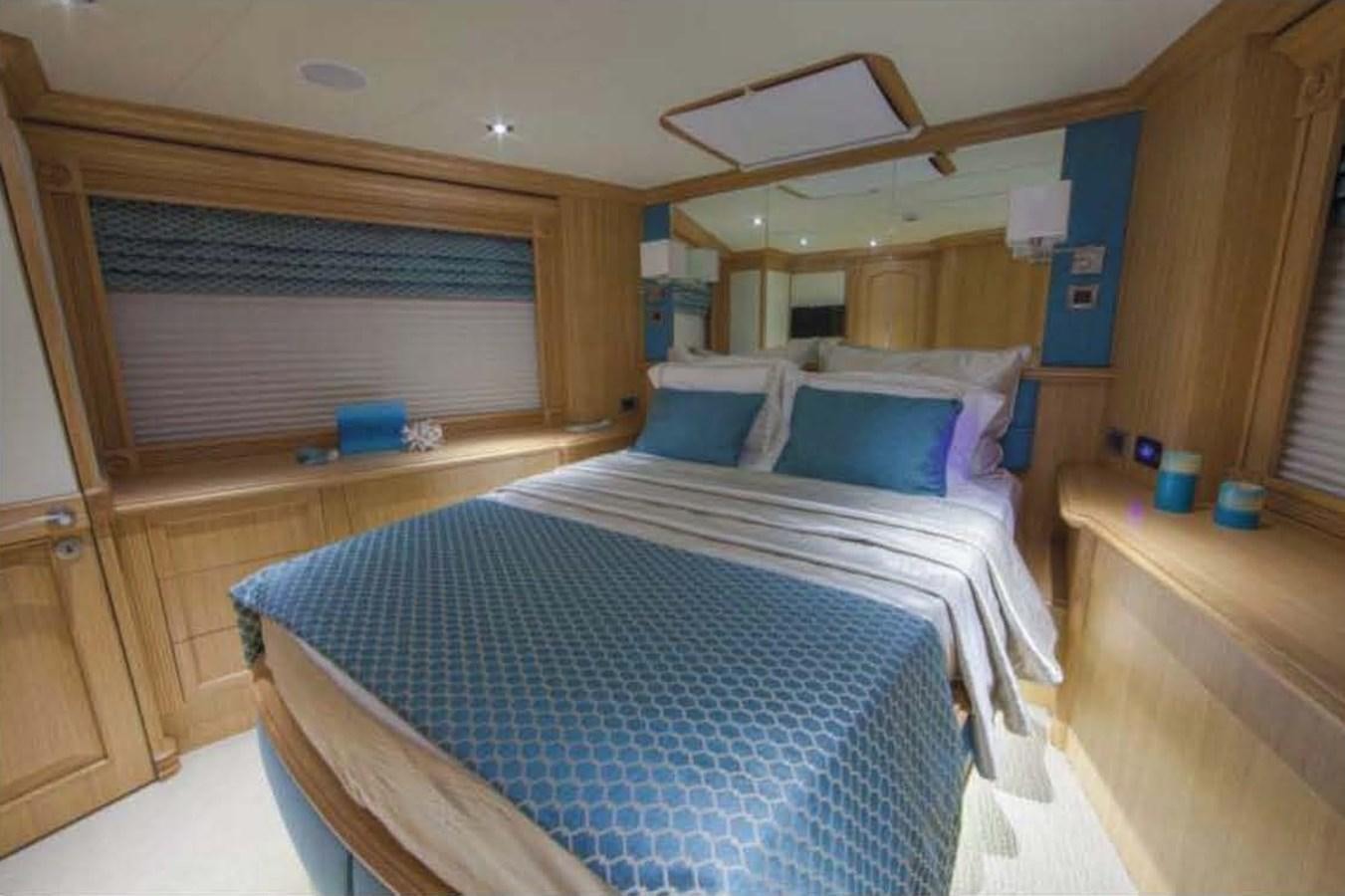 a bed in a room aboard UNDAUNTED Yacht for Sale