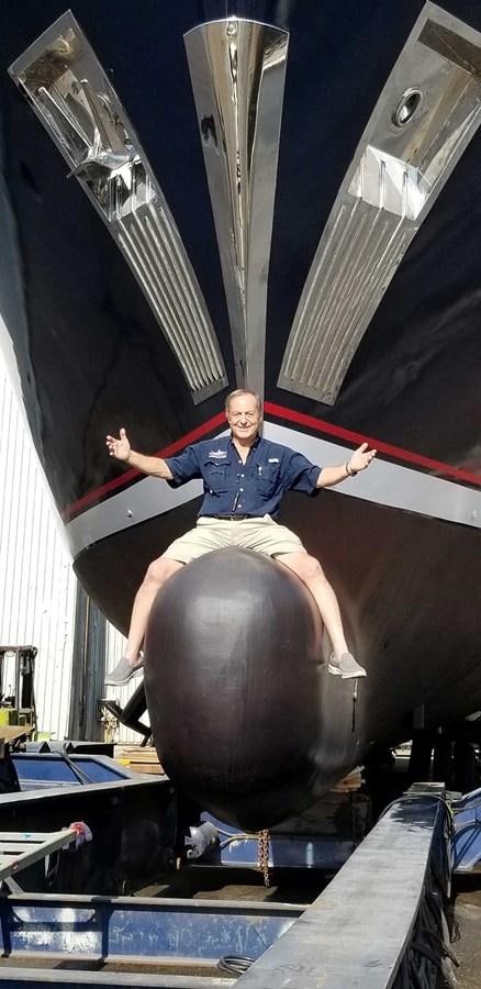 a person sitting on a large metal object aboard UNDAUNTED Yacht for Sale